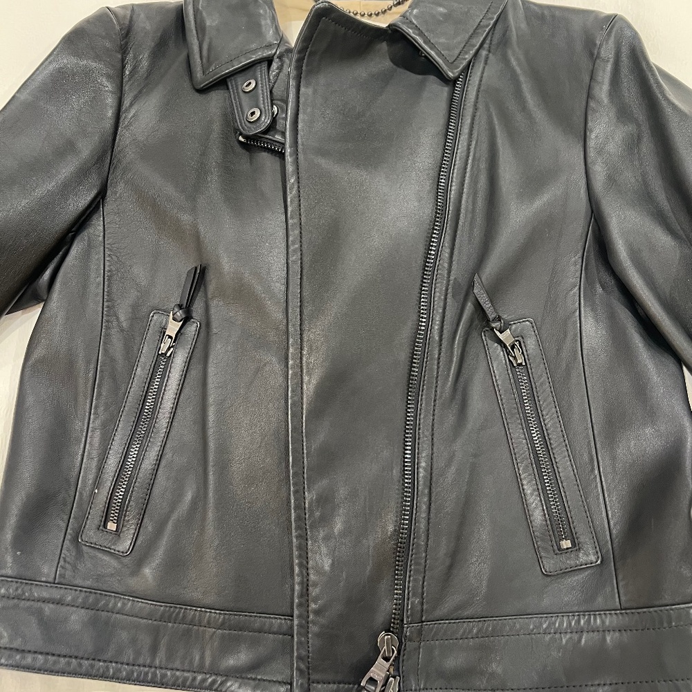 Leather jacket. Coach. Size medium.  Dark navy blue. Excellent condition.